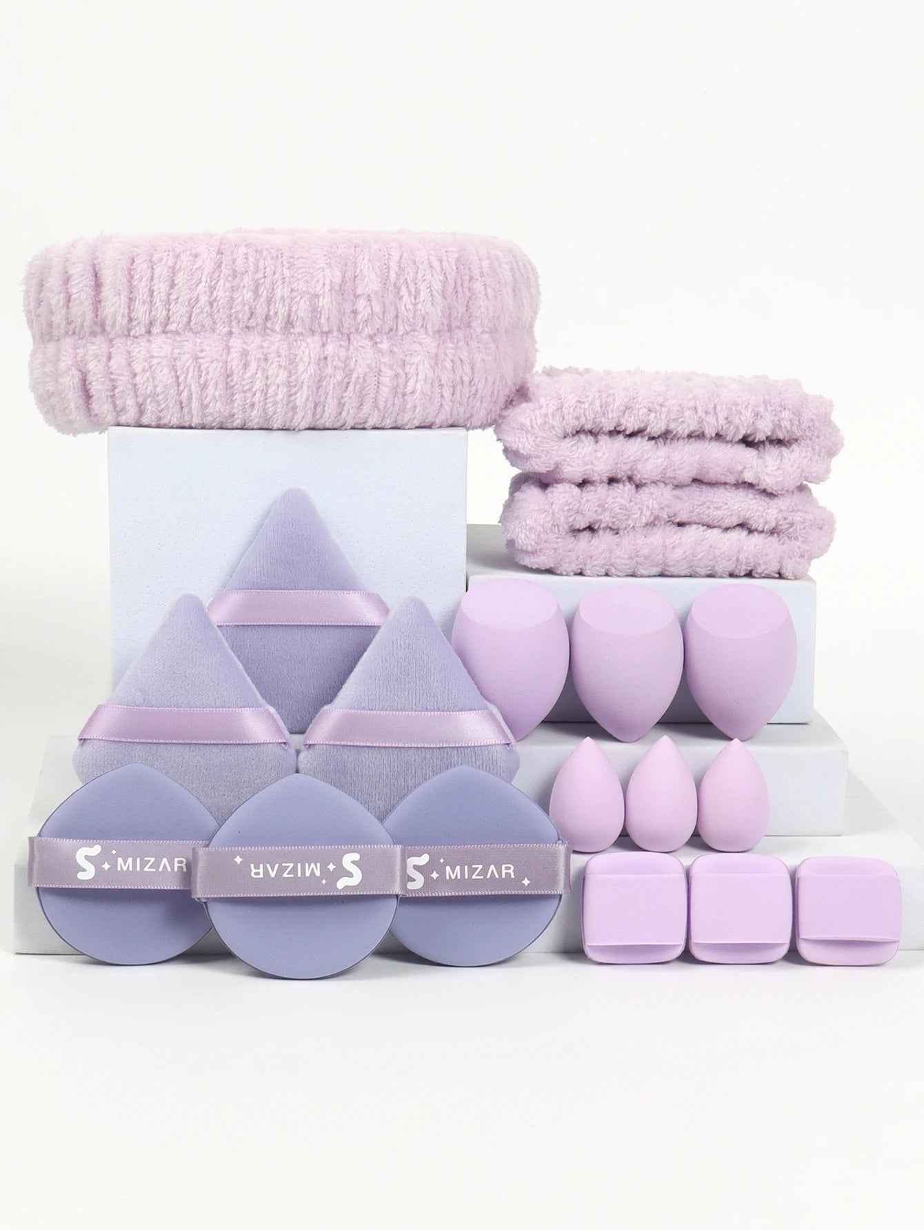 18 piece headband set. 1 hair band & 2 wrist bands & 3 make-up Sponges & 3 Mini Square Air Cushions & 3 triangular powder puff &