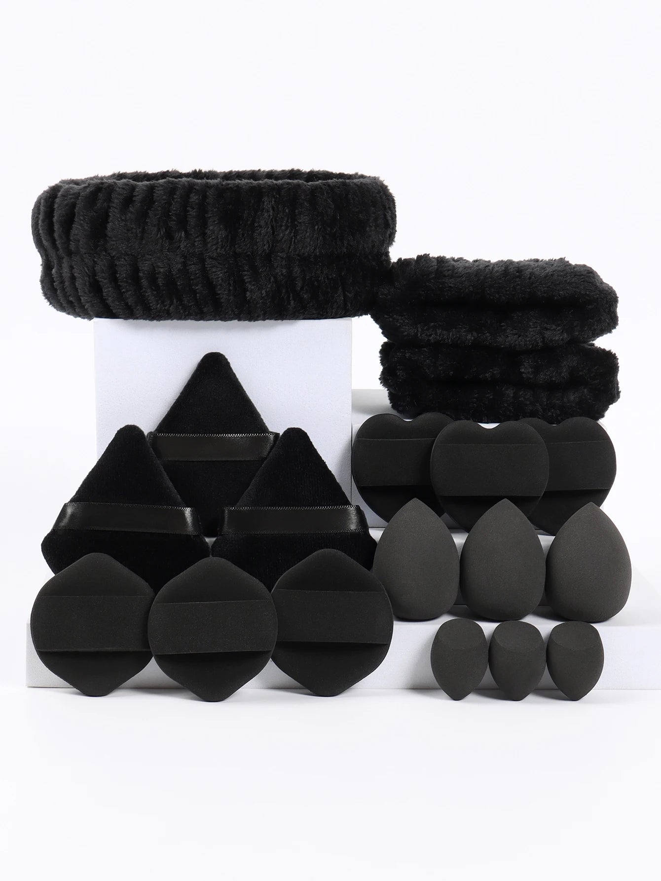 18 piece headband set. 1 hair band & 2 wrist bands & 3 make-up Sponges & 3 Mini Square Air Cushions & 3 triangular powder puff &